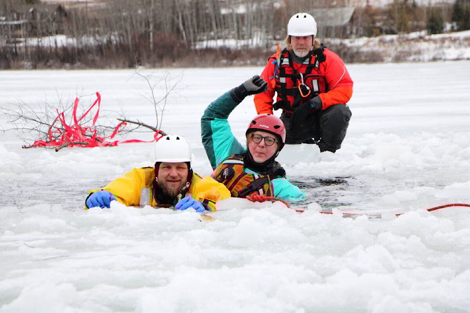 Members of South Cariboo Search and Rescue spent last Saturday practicing their ice rescue skills on the 108 Mile Ranch Lake. This included Jordan Fosbery (left), Rose Frost and ice rescue trainer Neil Mason. (Patrick Davies photo - 100 Mile Free Press) 