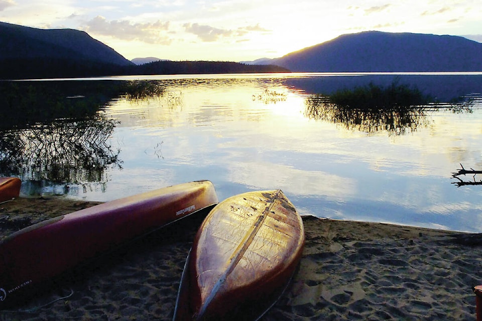 Two canoes rest on a beach next to Murtle Lake. The campsite there is now closed due to the threat of wildfire. (Keith McNeill/Black Press Media)