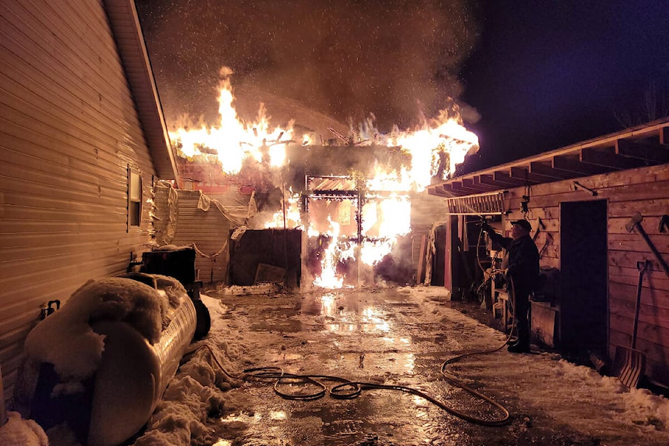Barb and Pete Pelton are thankful for quick action by family, neighbours and the Clearwater Fire Department that saved their home when the detached shop with Pete’s collector cars inside was destroyed by fire approx. 11 p.m. on Jan. 25 (Photo by: Candus Pelton-Graffunder) 