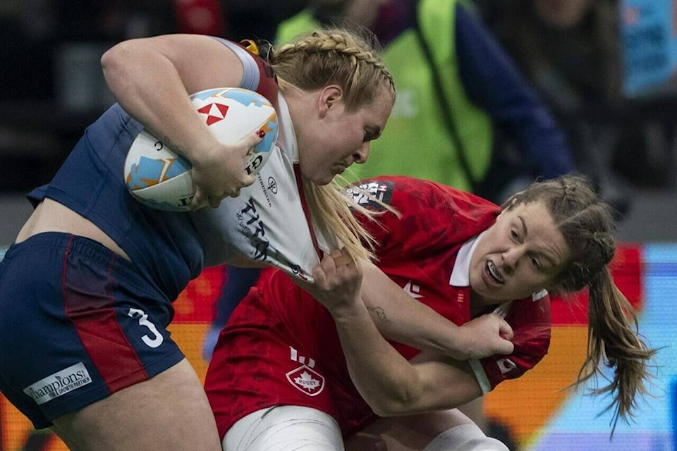 Canada’s Sophie De Goede grabs Great Britain’s Abi Burton during Vancouver Sevens women’s rugby action, in Vancouver, on Friday, Feb. 23, 2024. THE CANADIAN PRESS/Ethan Cairns 