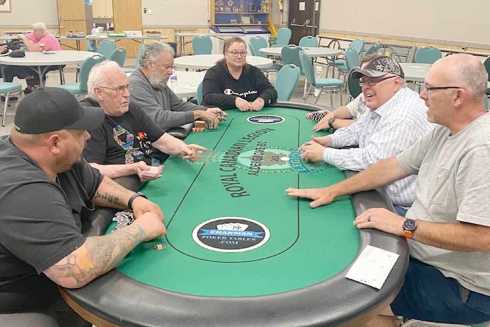 The final table at the Mangat family poker tournament and cancer fundraiser, held at the Royal Canadian Legion Aldergrove branch last year saw the top three players all donate their winnings back, including first-place finisher Jeff Mearcher from Misson (far left) and second-place Chad Blondin of Abbotsford (second from right). (Special to 91ԭ Advance Times) 