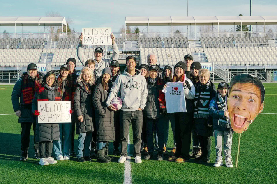 When Paris Gee (centre) signed with Vancouver FC, his dad Donald (right) was at his side when the team took a photo of family and friends at the Willoughby playing field, next to the 91ԭ Events Centre. It was taken a few weeks after Donald suffered acute kidney failure, leading the team to issue an unusual public appeal for prospective donors. (Beau Chevalier/Special to 91ԭ Advance Times) 