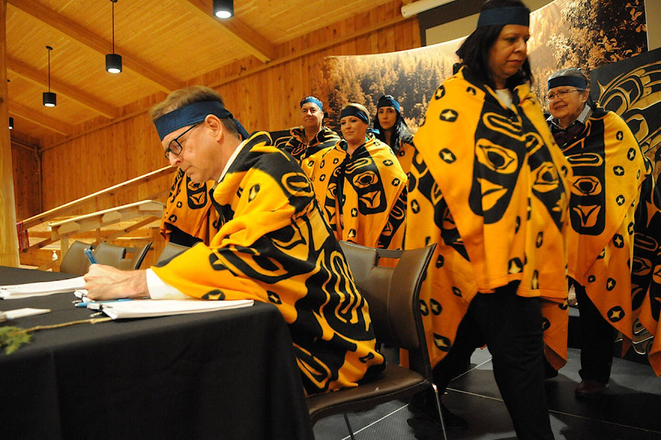 B.C. Health Minister Adrian Dix signs the renewed Fraser Partnership Accord at the Shxwhá:y Village Cultural Centre on Thursday, Feb. 1, 2024. (Jenna Hauck/ Chilliwack Progress) 