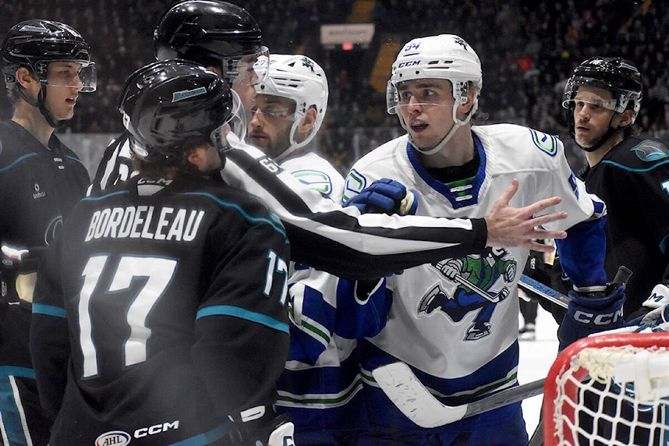 Abbotsford’s Linus Karlsson engages in some after the whistle activities with a San Jose player on Saturday. (Ben Lypka/Abbotsford News) 