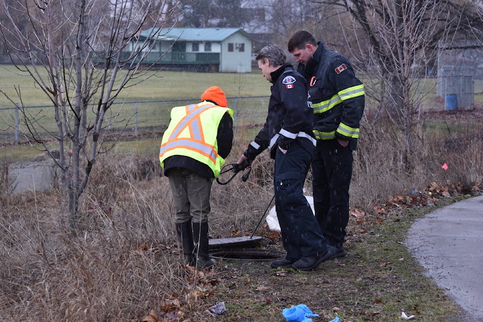 A manhole near 1634 Highway 97 S is leaking into Mill Creek. (Brittany Webster/Capital News) 