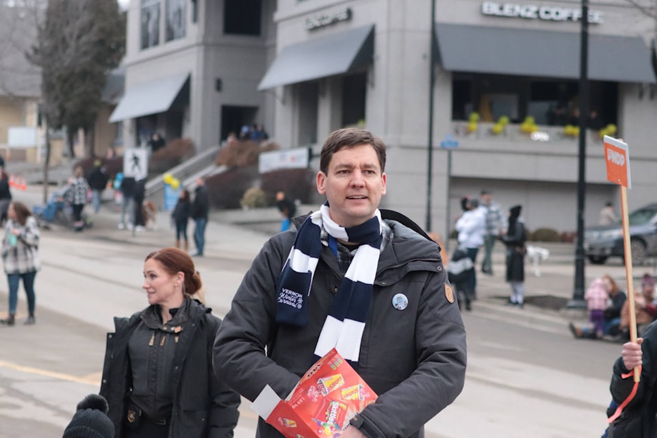 Eby hands out candy as he takes part in the parade Saturday along 30th Street. (Brendan Shykora - Morning Star) 