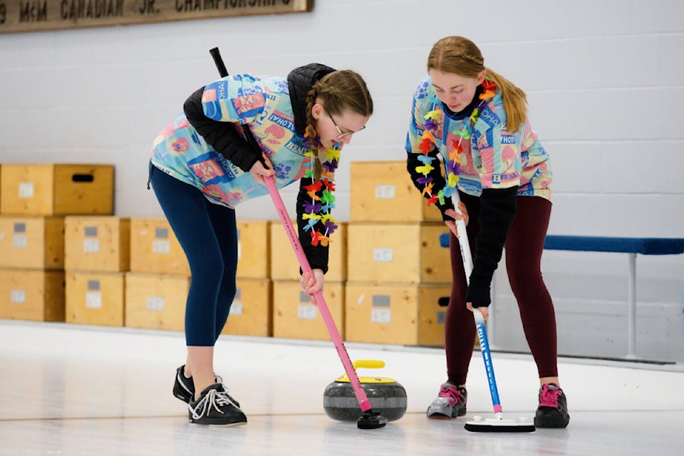 Salmon Arm’s Madison Shellborn and Lauren Crossman guide a rock down the centre line towards the house during the Junior Bonspiel at the Salmon Arm Curling Centre on Saturday, Feb. 10, 2024. (Kayleigh Seibel Photography) 
