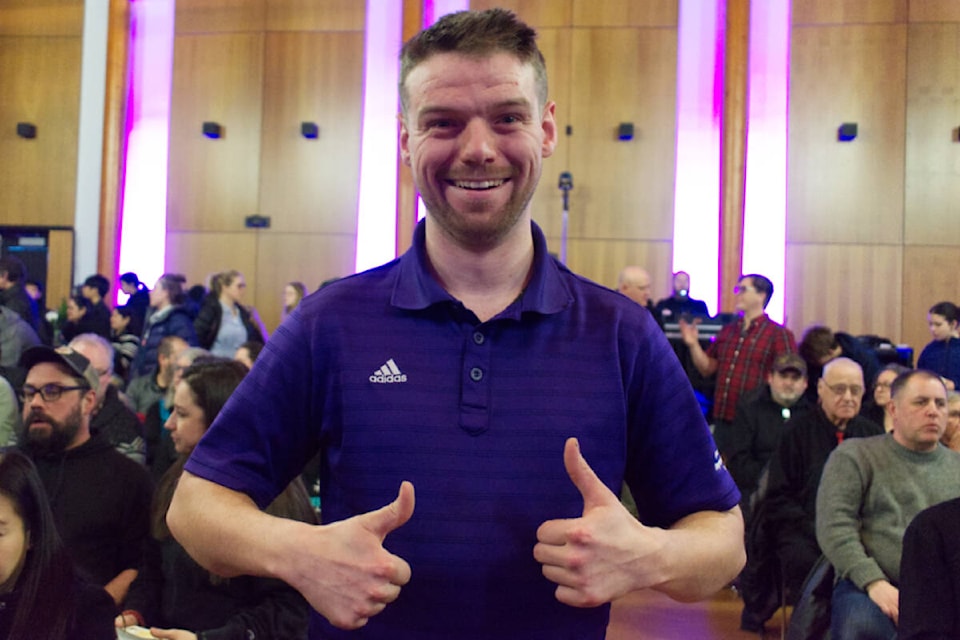 Michael Sumner gives two big thumbs up for winning three Yukon sports awards: the premier’s award, the minister’s award and an athlete of the year award from Special Olympics Yukon at a ceremony at the Kwanlin Dün Cultural Centre on Feb. 12. (Dana Hatherly/Yukon News) 