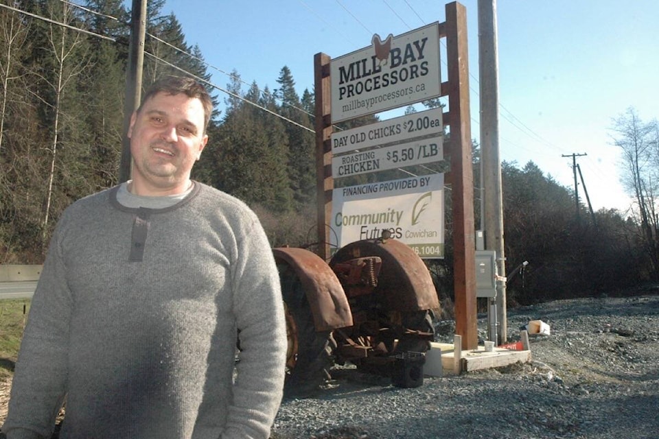Thomas Hyde, owner of Mill Bay Processors, stands in front of the sign for the state-of-the-art poultry-processing plant, which is located on the Trans-Canada Highway in Mill Bay. (Robert Barron/Citizen) 