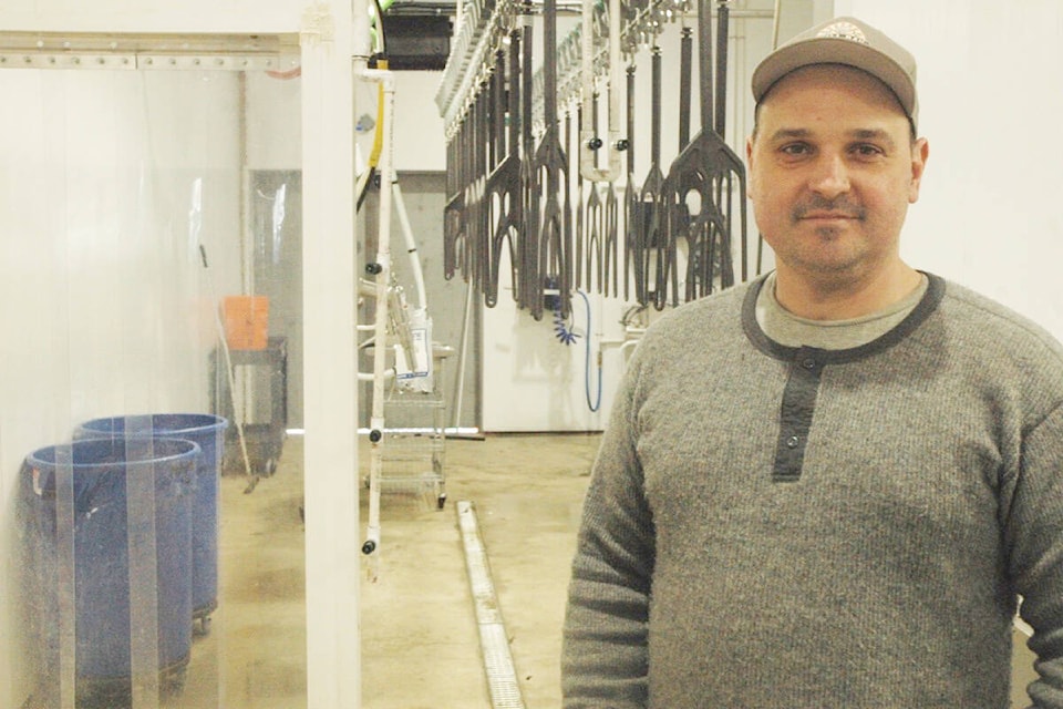 Thomas Hyde, owner of Mill Bay Processors, stands in front of the assembly line at the state-of-the-art poultry-processing plant. (Robert Barron/Citizen) 