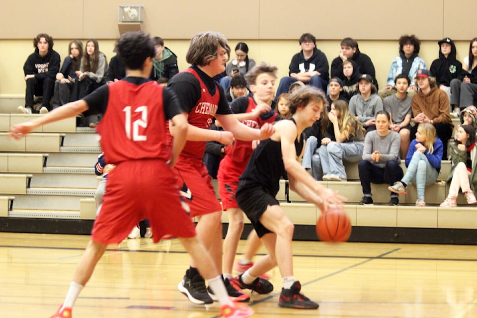 Jordan Allinott, Brayden Screaton and Cuyler Wilson play a smothering defence against Quamichan. (Photo by Don Bodger) 