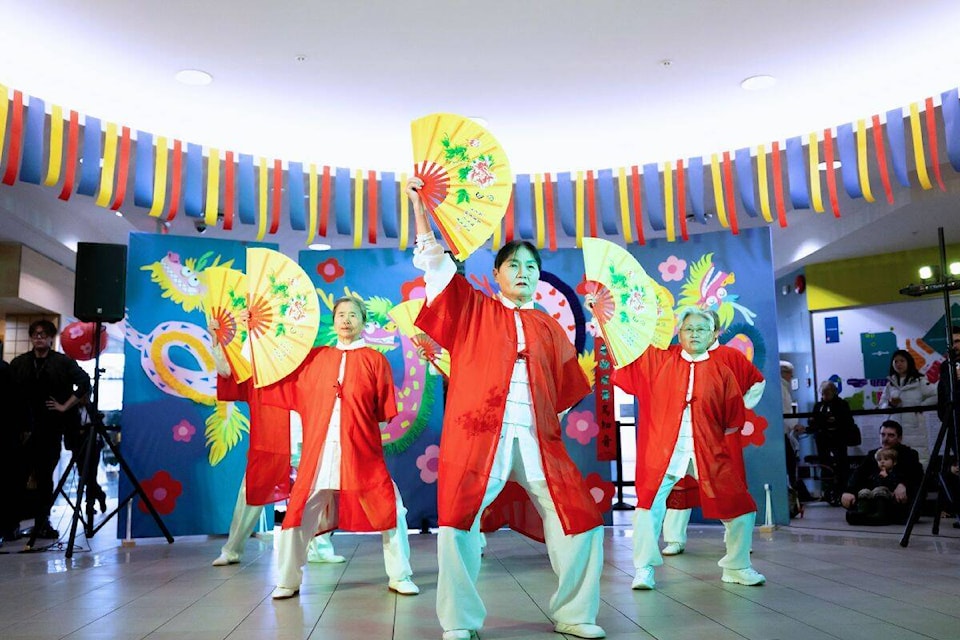 A group showcases a Tai Chi fan performance at the Chinese Village Club’s Semiahmoo Lunar New Year celebration, held at Semiahmoo Shopping Centre in South Surrey Saturday (Feb. 10). (Anna Burns photo) 