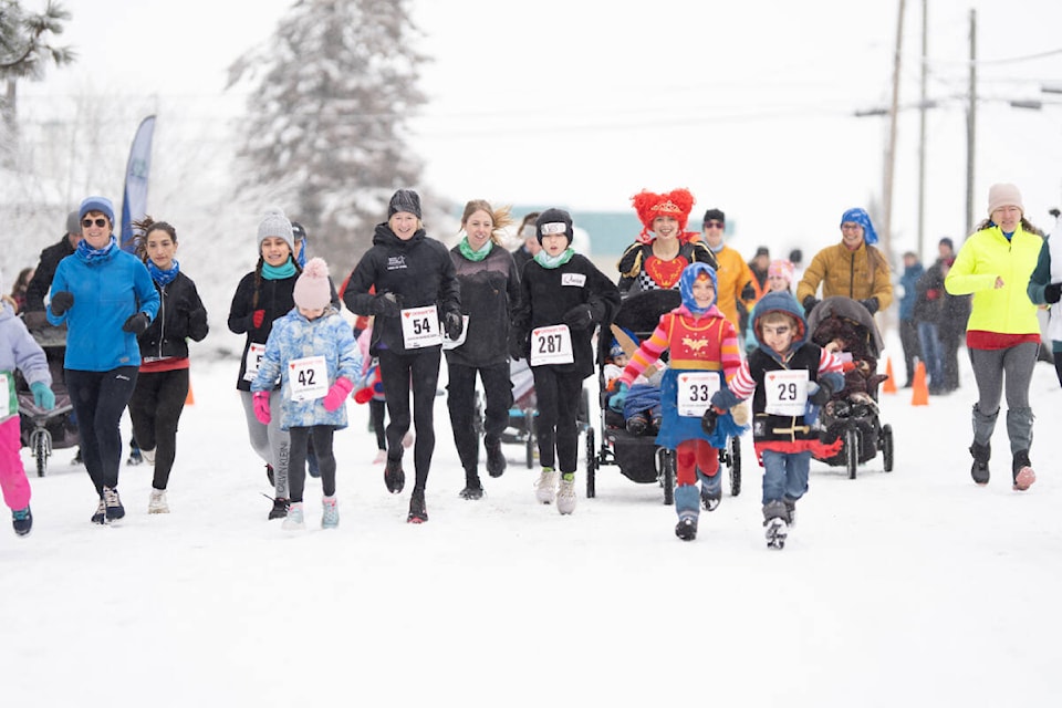 It was all smiles despite the snow in the Starting Block three kilometre running race Feb. 11. (Virginia Sellars photo) 