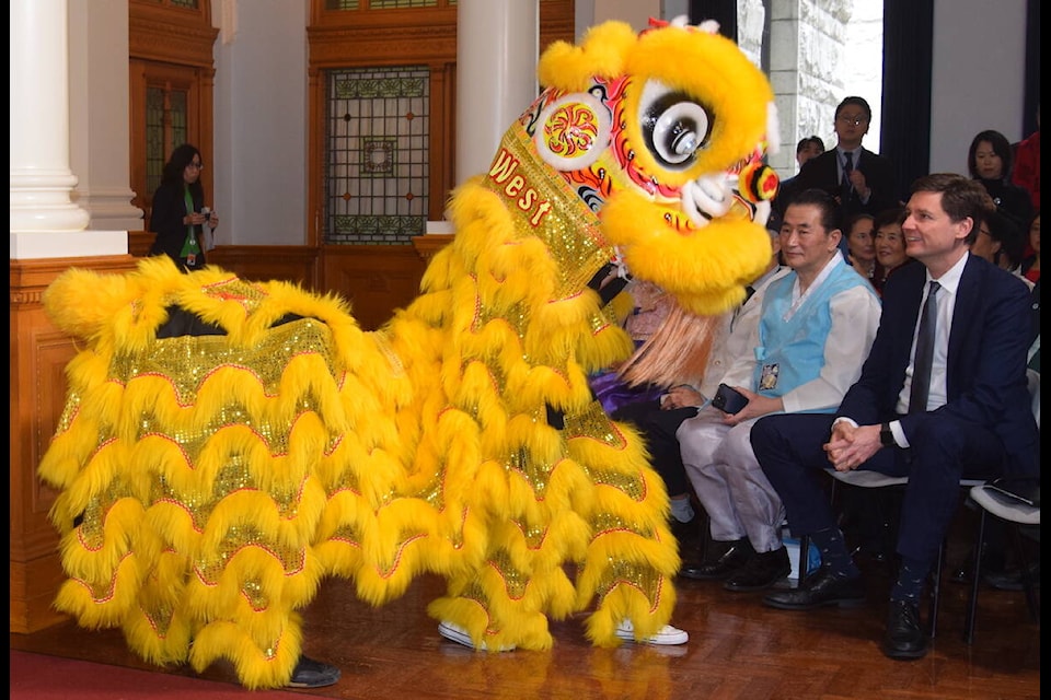 Premier David Eby watches the Ging Wu West Lion Dancers perform at a Lunar New Year celebration at the B.C. legislature on Wednesday (Feb. 21). (Brendan Mayer/News Staff) 