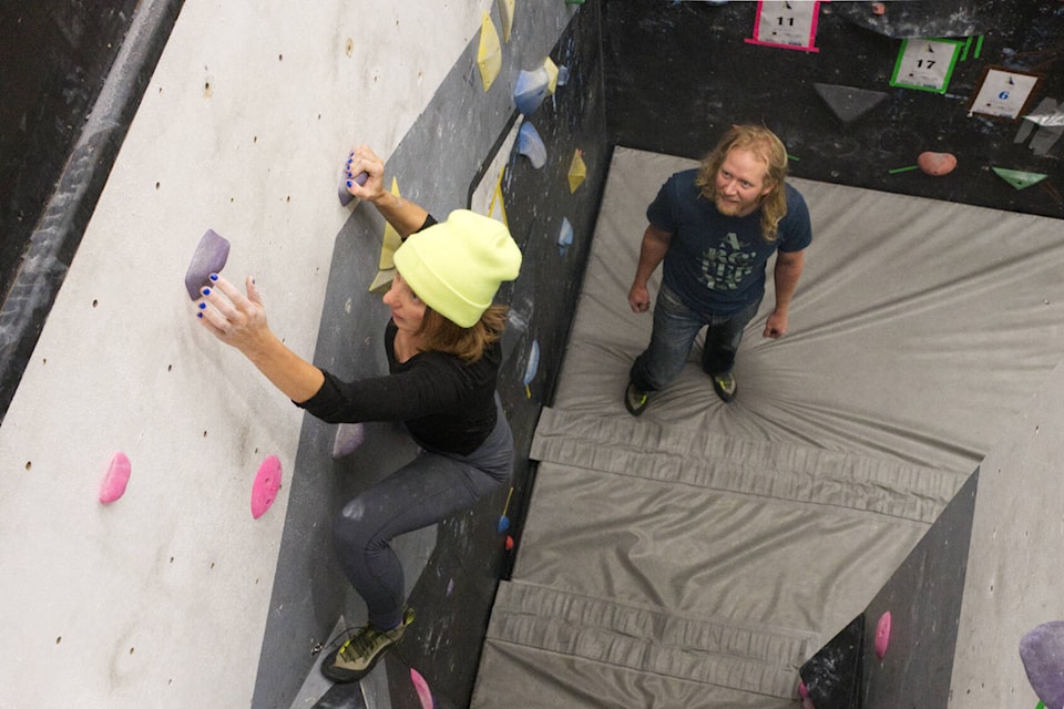 Nelly Bouevitch reaches the top of a wall during the Yukon Climbing Championships bouldering competition on Feb. 18. (Jim Elliot/Yukon News) 