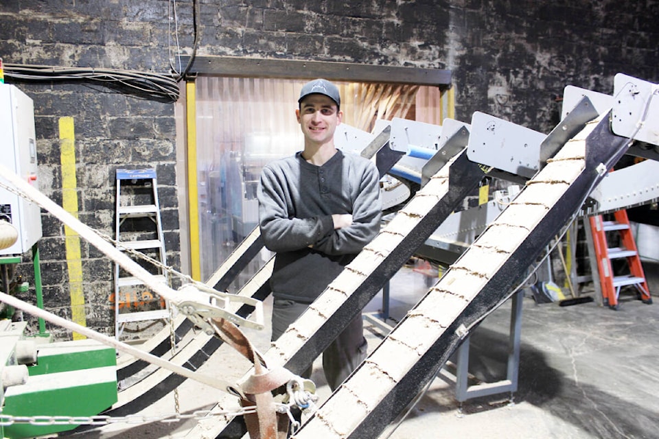 Briquettes coming out on a conveyor and ready for packaging. (Photo by Don Bodger) 