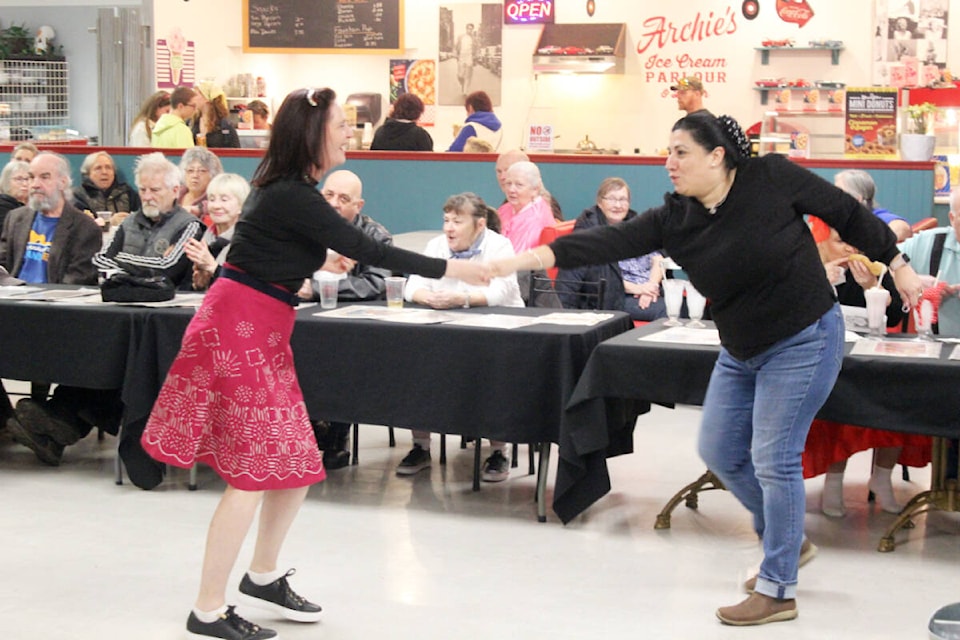 Dazzling moves are displayed on the dance floor by Patricia Edwards, left, and Mily Peterson. (Photo by Don Bodger) 