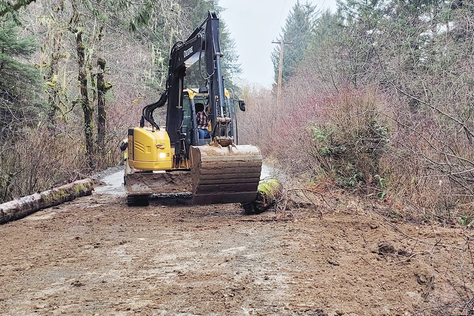 An excavator was used to prepare an alternate route to Ditidaht First Nation to avoid a large sinkhole. (Submitted photo) 
