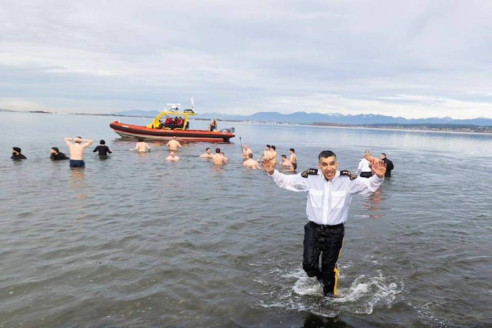 Participants in the Surrey RCMP ‘Polar Plunge’ at Blackie Spit park in Crescent Beach on Saturday (Feb. 17) brave the chilly ocean waters. (Anna Burns photo) 