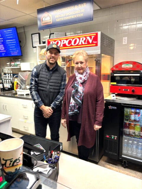 Keith Construction’s Bryce Dahlen and Okanagan Screen Arts Society director Judy Korol at the Towne Theatre’s concession, now sponsored by Keith Construction. The company has agreed to help with renovation costs with a $3,000 donation per year over 10 years = $30,000. (Contributed) 