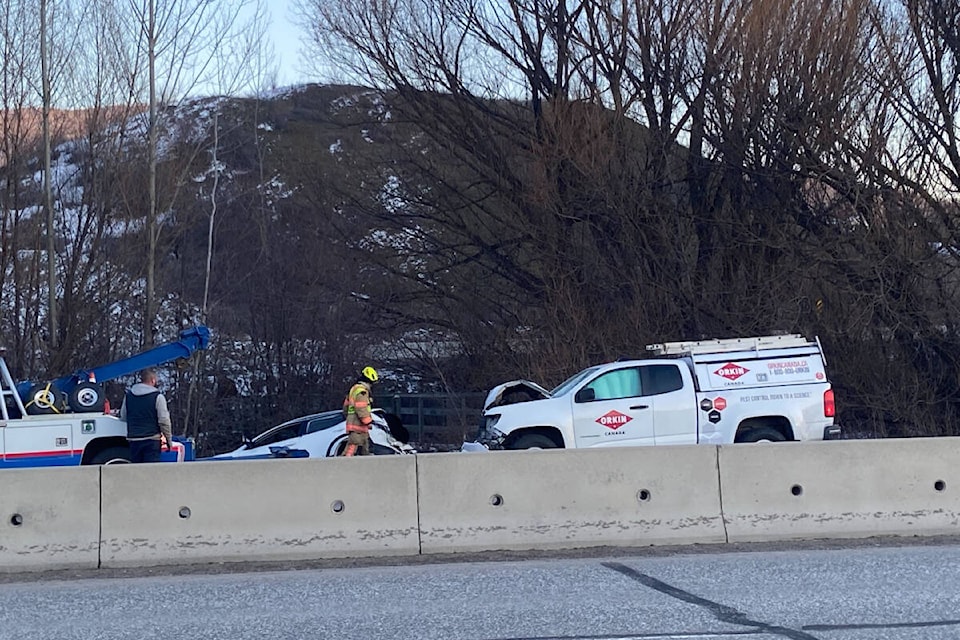 Emergency personnel attend to a two-vehicle collision at 27th Street and Highway 97 late Friday afternoon, Feb. 16, in Vernon. Northbound traffic was slowed considerably as crews dealt with the scene. Two people were checked out on-scene by medical services, and a third person declined treatment. (Jennifer Smith - Morning Star) 