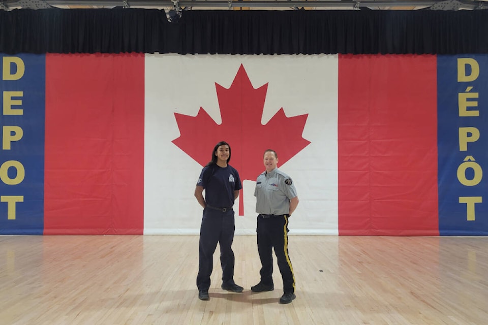 (Left to right) Grade 12 student Anthony Andrew-Charles and Cst. Cole Brewer pose in Regina at the Youth Leadership Workshop hosted by the RCMP. (Courtesy of the RCMP) 