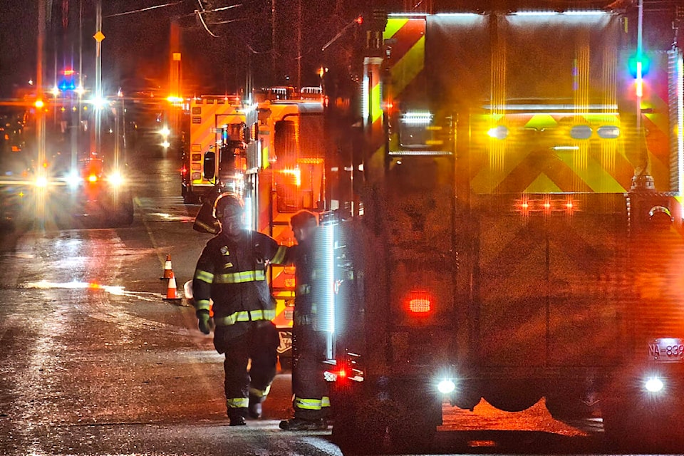 Multiple fire trucks were called to the scene of a house fire on 240th Street near 61st Avenue Sunday, Feb. 25. (Dan Ferguson/Langley Advance Times) 