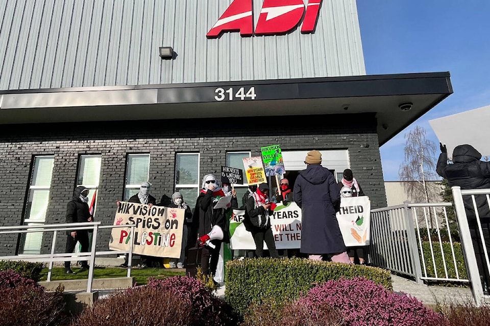 A small group of demonstrators gathered outside of a Hikvision event in Burnaby on Feb. 27, 2024, to protest the company’s supplying of surveillance cameras to Israel. (Submitted photo) 