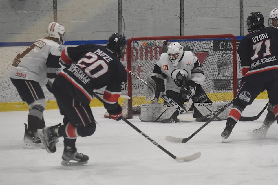 Comox Valley goalie Ryan Knight stops Oceanside defenceman Tyson Pauze from point-blank range during a five-on-three Oceanside power play. The Glacier Kings would go on to win the game 4-2, taking the first game of the Vancouver Island Junior Hockey League North Division playoffs. Photo by Terry Farrell/Comox Valley Record 