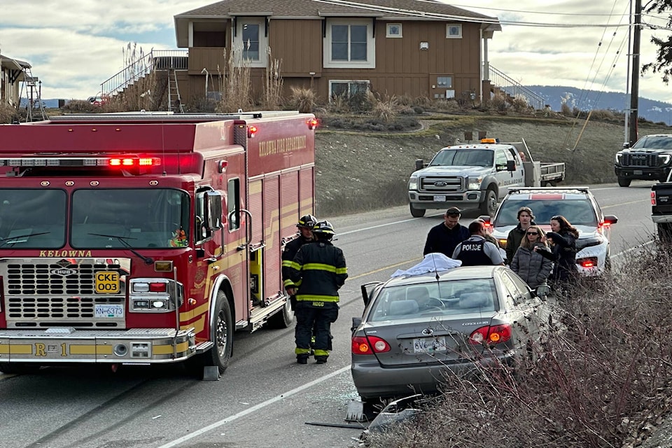 Emergency crews on the scene of a two-vehicle crash near the roundabout at Longhill, Cross and Valley roads on Feb. 27, 2024. (Jordy Cunningham/Capital News) 