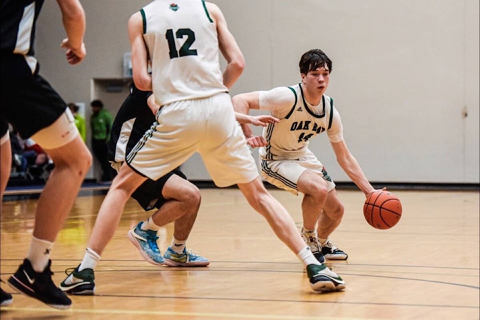 Oak Bay Bays Olin Lakus moves the ball up the court during the near comeback, but eventual semifinal loss to the Terry Fox Ravens at provincials Feb. 26. (Courtesy Ryan Molag/LEC) 