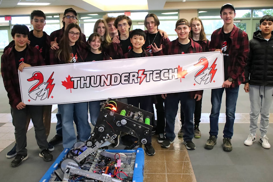 The Thomas Haney robotics team called ThunderTech Robotics consists of Quinn Gigliotti, Paige Wiens, Daria Okoneshnikova, Logan Humeniuk, Diego Niebla, Vincenzo Lombardi, Matvey Okoneshnikov, Daniil Batishchev, Monica Fisher, Mason Klokeid, Ari Sehrawat, Lance Wu, Charlie Page, and Mischka Olamit. (Brandon Tucker/The News) 