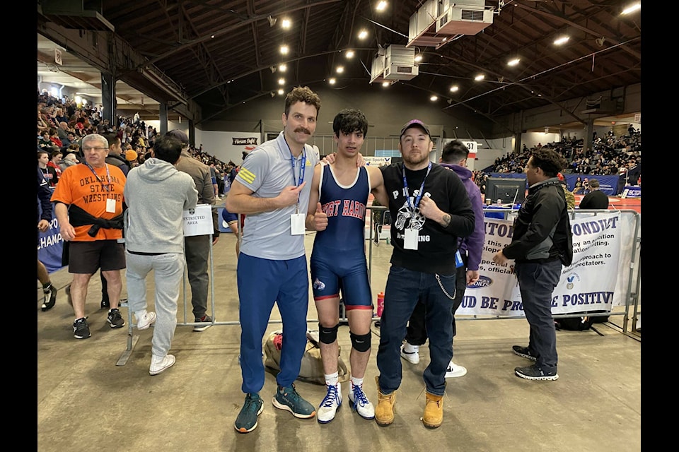 Head coach Paul Cagna, PHSS Grade 12 student Sheldon Frank, and assistant coach Tyson Whitney stop for a photo after Frank’s loss to Eli Ergas from Collingwood. (Tyson Whitney - North Island Gazette) 