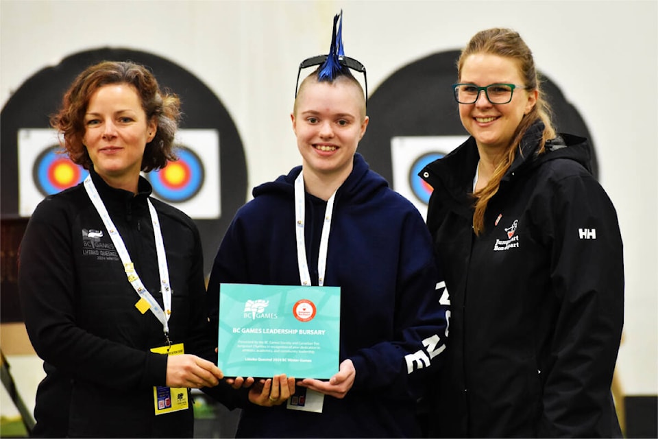 Lily Fraser (centre) was one of the 2024 recipients of the Jumpstart BC Games Leadership Bursary awards. She received it Feb. 23 just before her archery competition, presented by Lhtako Quesnel BC Winter Games vice-president Brenda Beatty (left) and Jumpstart regional manager Katlyn Soanes. (Frank Peebles photo - Quesnel Cariboo Observer) 