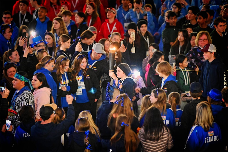 The Lhtako Quesnel BC Winter Games torch entered West Fraser Centre in the hands of local athletes, igniting the dreams of more than 1,000 of the province’s best young competitors there to enjoy the moment. (BC Games photo - Michael Mong) 