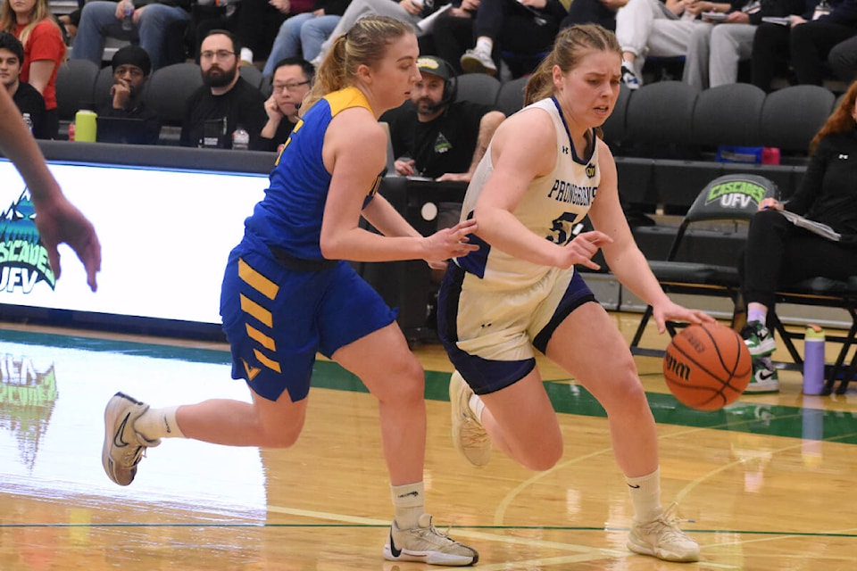 Lethbridge’s Viktoriia Kovalevska drives to the hoop against Victoria’s Sierra Reisig on Wednesday. (Ben Lypka/Abbotsford News) 