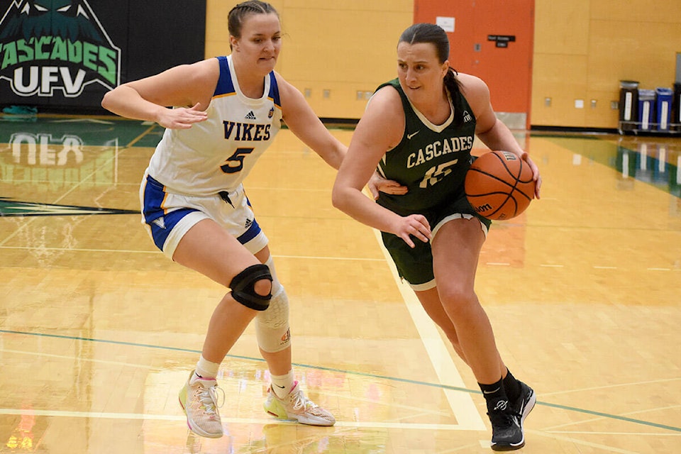 UFV’s Deanna Tuchscherer drives against Victoria’s Brooklyn White on Sunday (Feb. 25). (Ben Lypka/Abbotsford News) 