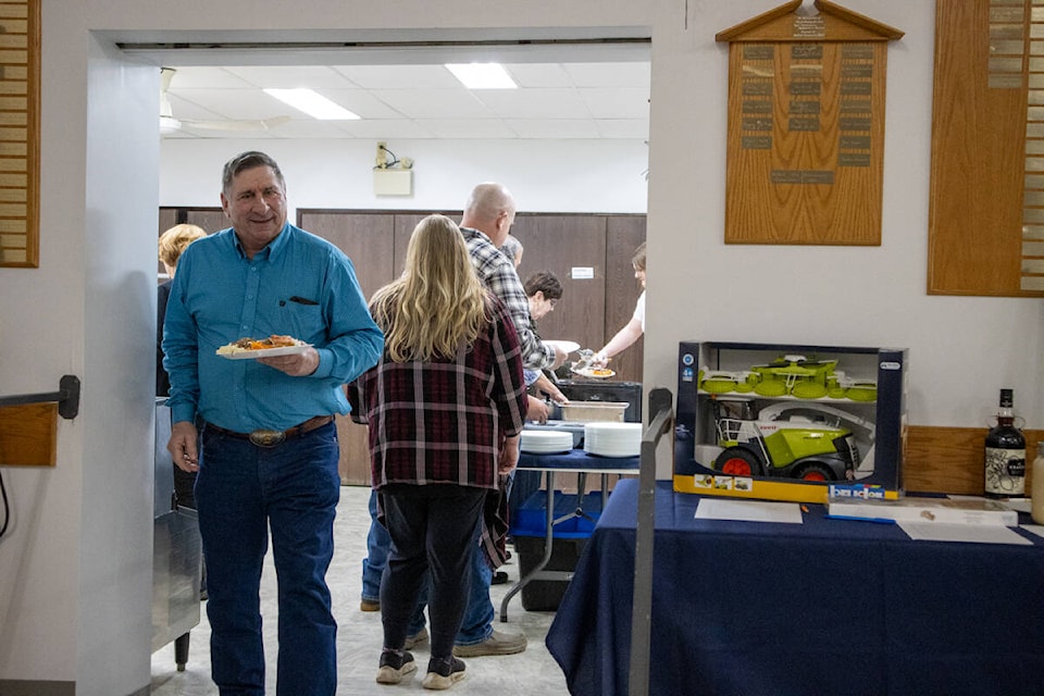 Attendees of the Halkirk Elks Seafood and Comedy night com out of the kitchen after loading up their plates!  