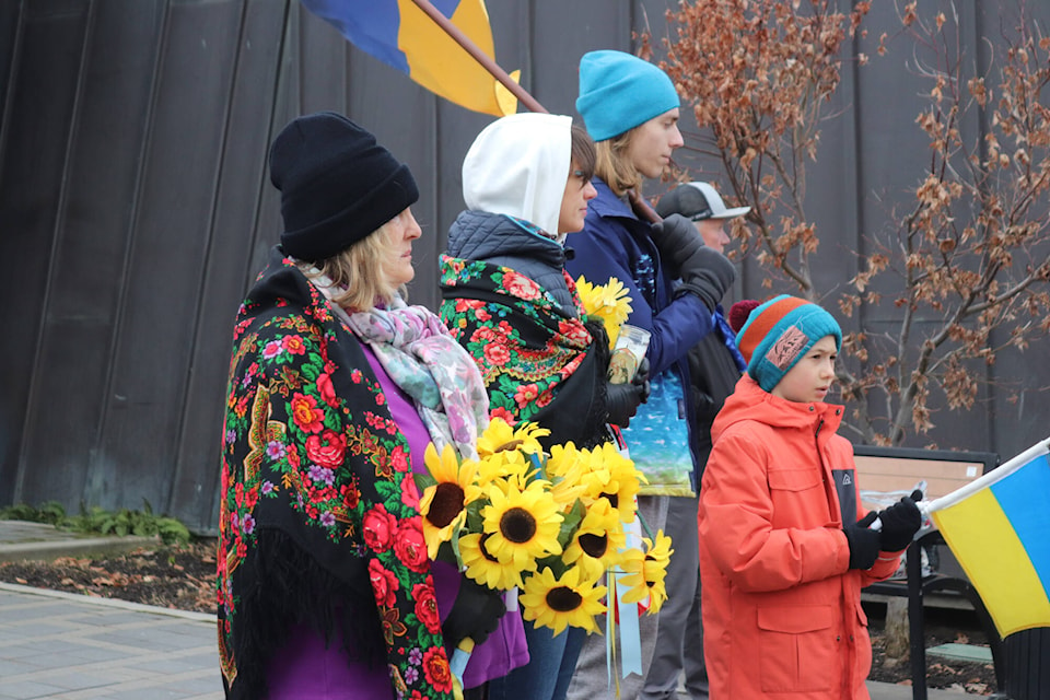 A group of people, among them Ukrainian newcomers, gathered at Vernon City Hall fora vigil marking the second anniversary of Russia’s invasion of Ukraine Saturday, Feb. 24, 2024. (Brendan Shykora - Morning Star) 