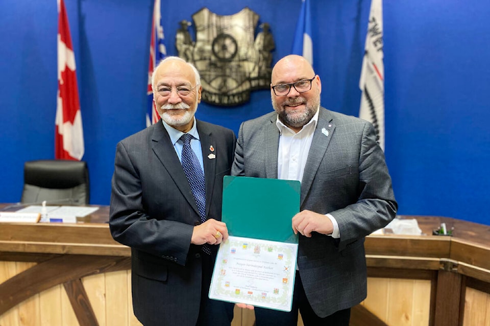 Mayor Surinderpal Rathor with Member of Parliament Todd Doherty on Feb. 23, 2024, at city hall in Williams Lake. Rathor was presented with the Queen Elizabeth II Platinum Jubilee Pin. (Kim Kimberlin photo - Williams Lake Tribune) 