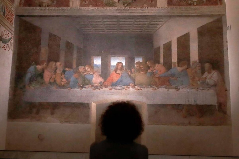 A woman admires Leonardo da Vinci’s painting ’ The Last Supper ‘, dating back to 1494-1498 and preserved at the ex-Renaissance refectory of the convent adjacent to the sanctuary of Santa Maria delle Grazie church, in Milan, Italy. (AP Photo/Antonio Calanni) 