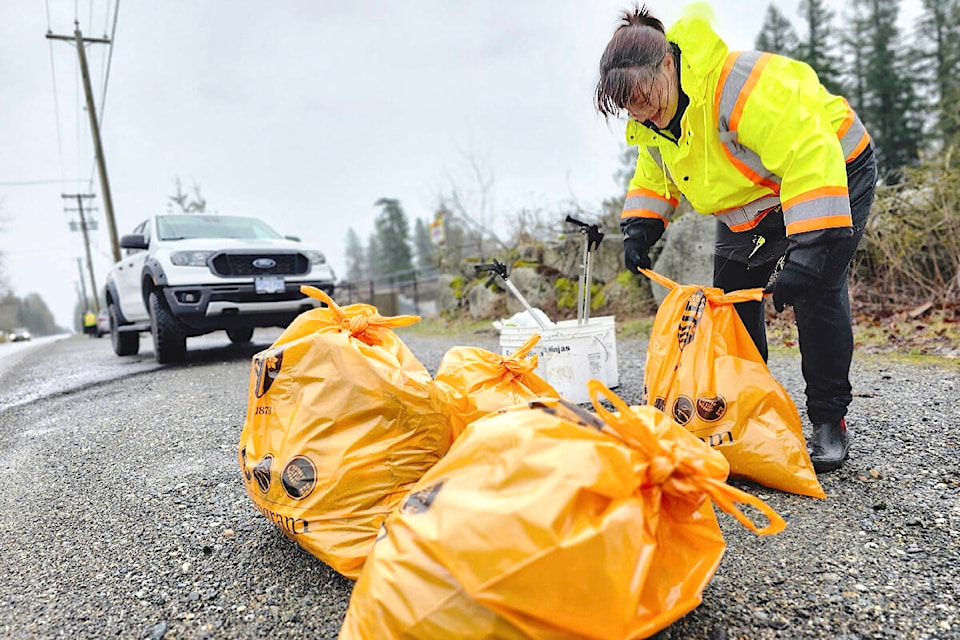 A two-hour litter hunt in rainy, windy conditions, by Earth Ninjas founder Jocelyn Titus and two volunteers along 8th Avenue between 264th and 272nd Streets on Sunday, Feb. 25 filled 10 bags with 320 lbs. of trash, (Dan Ferguson/Langley Advance Times) 