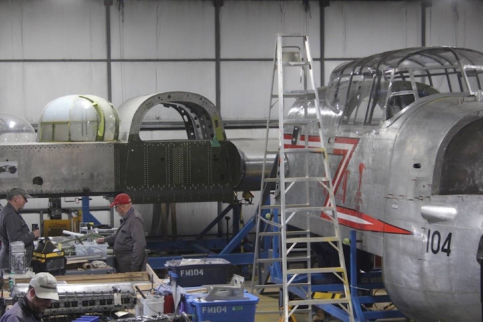 Volunteers work on pieces of an Avro Lancaster Mark 10 in the renovation hangar at the BC Aviation Museum in North Saanich. (Christine van Reeuwyk/News Staff) 