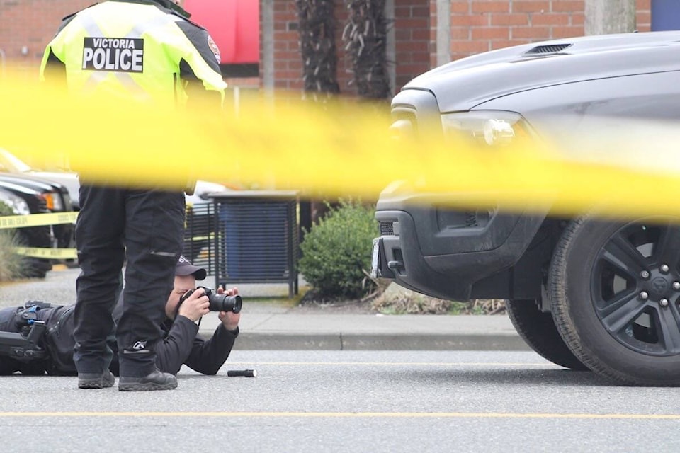 VicPD officers investigate after a pedestrian was killed March 1 on Hillside Avenue in Victoria. (Jake Romphf/News Staff) 