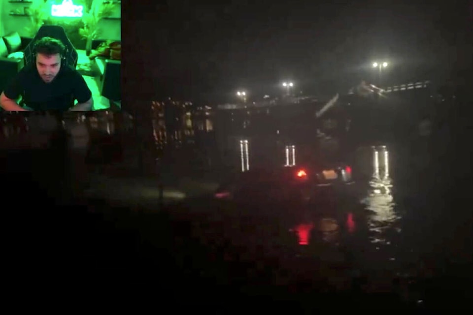A screenshot from a live-streamed video on Kick shows a B.C. teen driving a car into the Burrard Inlet on Monday night (March 4). (@AdinRossEmpire/X) 