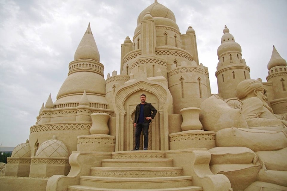 A decade ago, 72 professional sand sculptors set out to carve 30,000 tonnes of sand into a small town. Halfway through the project, a rainstorm hit. (Photo by Damon Langlois) 