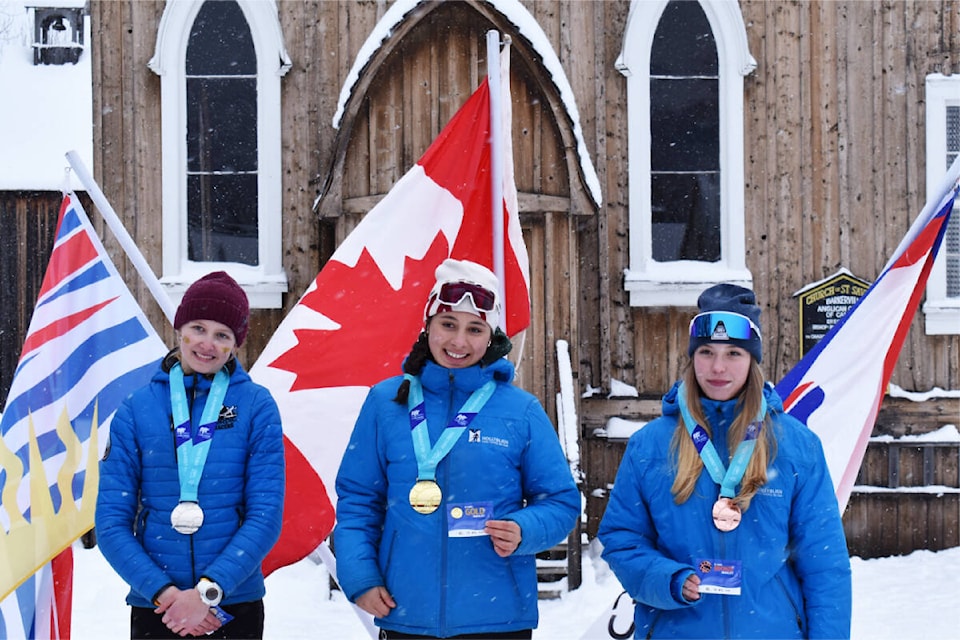 Annika Vipler (centre) won gold in the girls cross-country skiing event at the Lhtako Quesnel BC Winter Games. With her on the podium is Vipler’s Hollyburn Ski Club teammate Emelie Kvick with the bronze (right) and Revelstoke skier Ember Smith with the silver (left). The race was held on the streets of Barkerville. (Frank Peebles photo - Quesnel Cariboo Observer) 