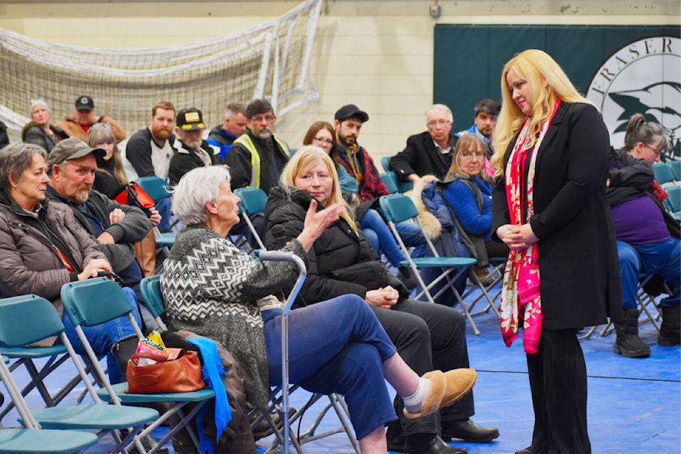 Fraser Lake mayor Sarrah Storey hears from longtime resident Doris Honeyman during a Feb. 29 town hall meeting to discuss the closure of West Fraser’s sawmill in that community. (Frank Peebles photo - Quesnel Cariboo Observer) 