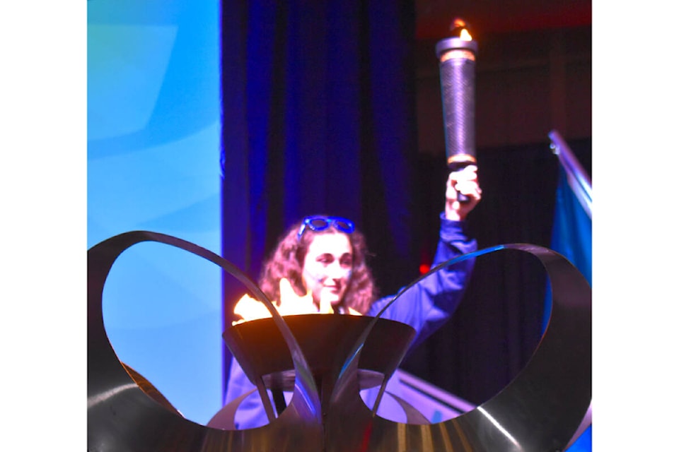 Abbey MacKay’s torch set the Lhtako Quesnel BC Winter Games cauldron alight, kicking off the multi-sport and multicultural extravaganza for youth. (Frank Peebles photo - Quesnel Cariboo Observer) 