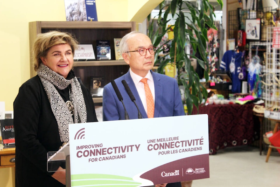 Gudie Hutchings and George Chow at the podium. (Photo by Don Bodger) 